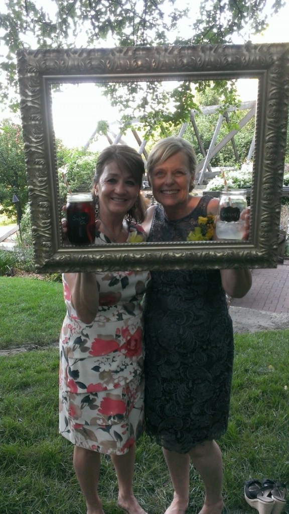 We hung a picture frame from a tree branch for silly pictures during the social hour (between the ceremony and dinner).  HUGE SUCCESS for our guests!